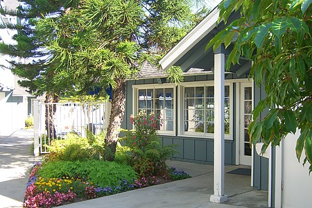 Cape Cod-style cottage with a flowering garden at The Beach House